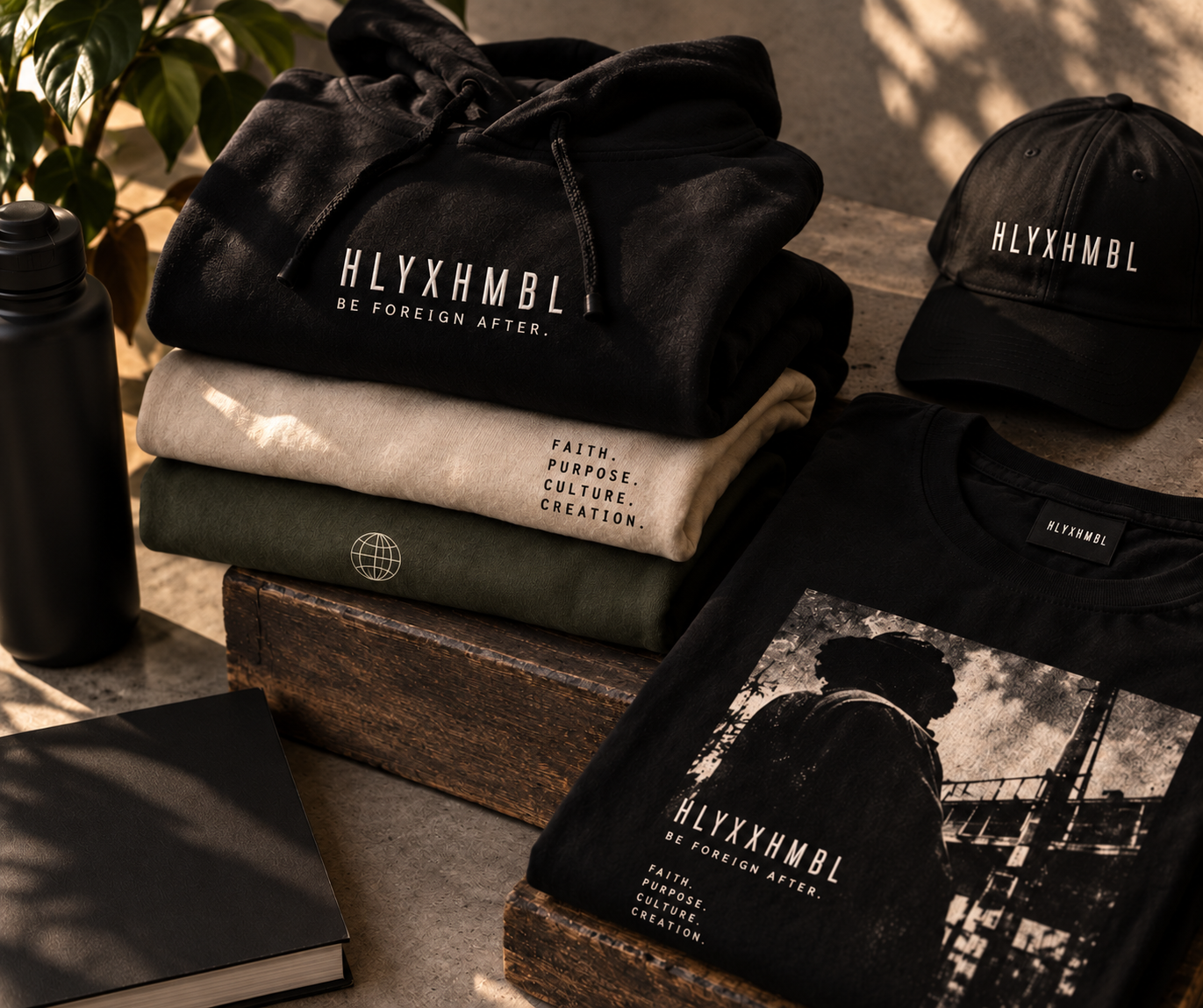 HLYXHMBL hoodies, cap, and printed apparel arranged together